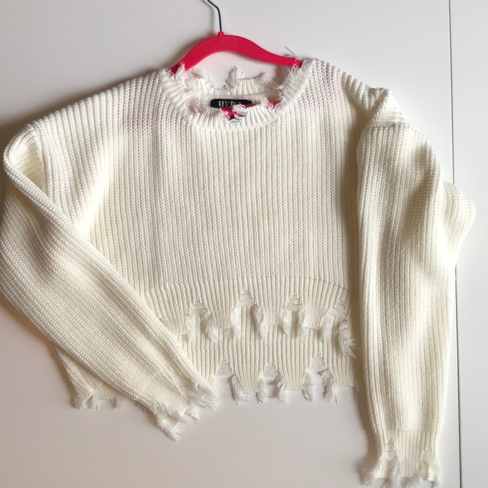 Distressed white sweater